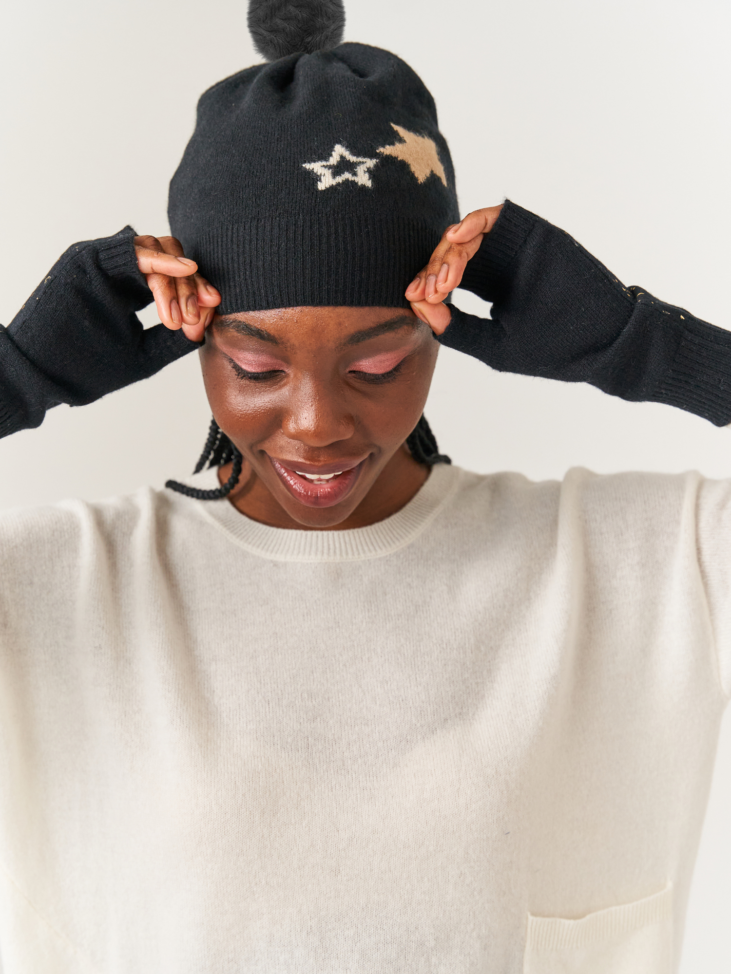 Lady in black cashmere hat with stars on