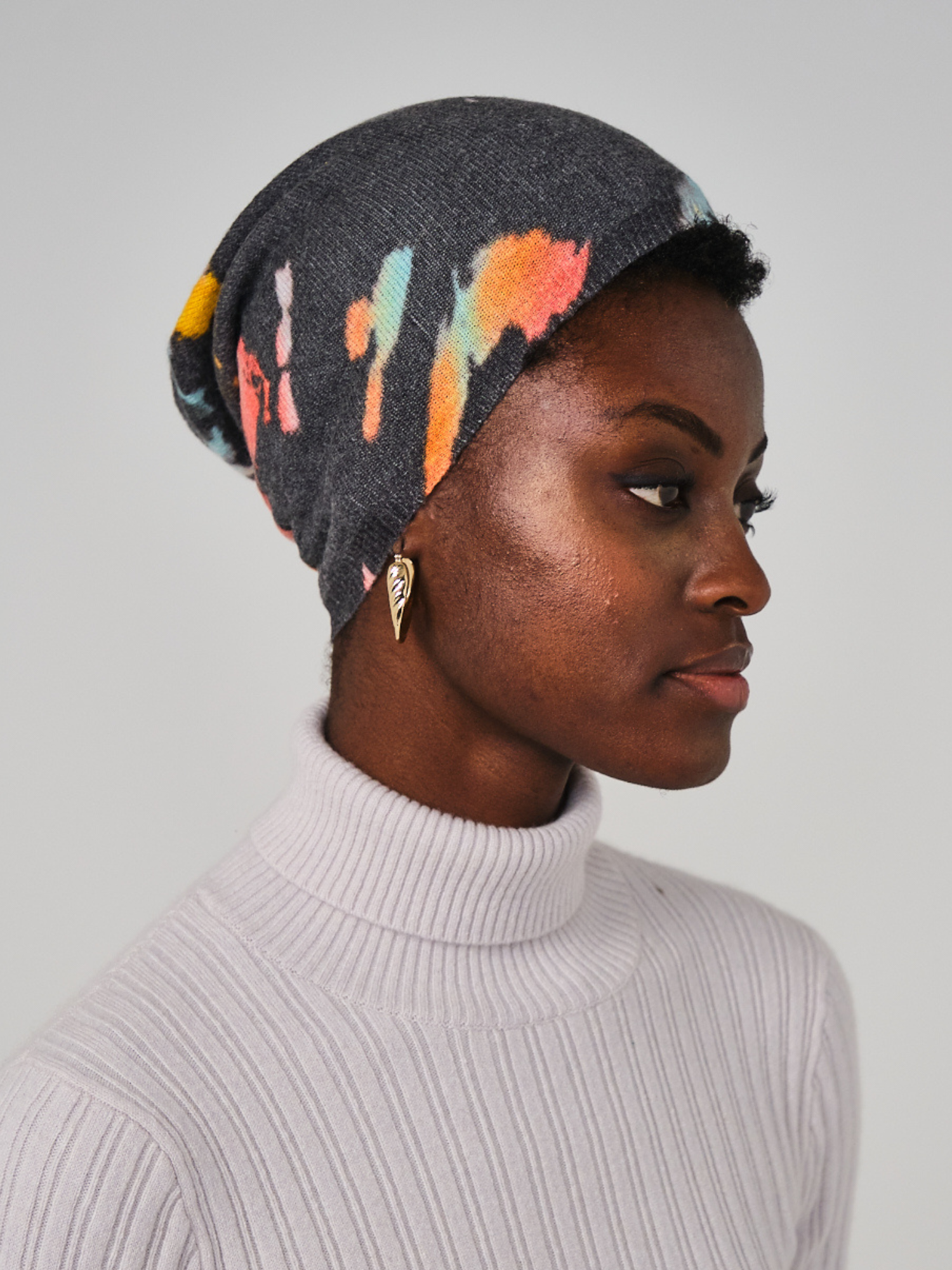 Women wearing black and multi colour hat