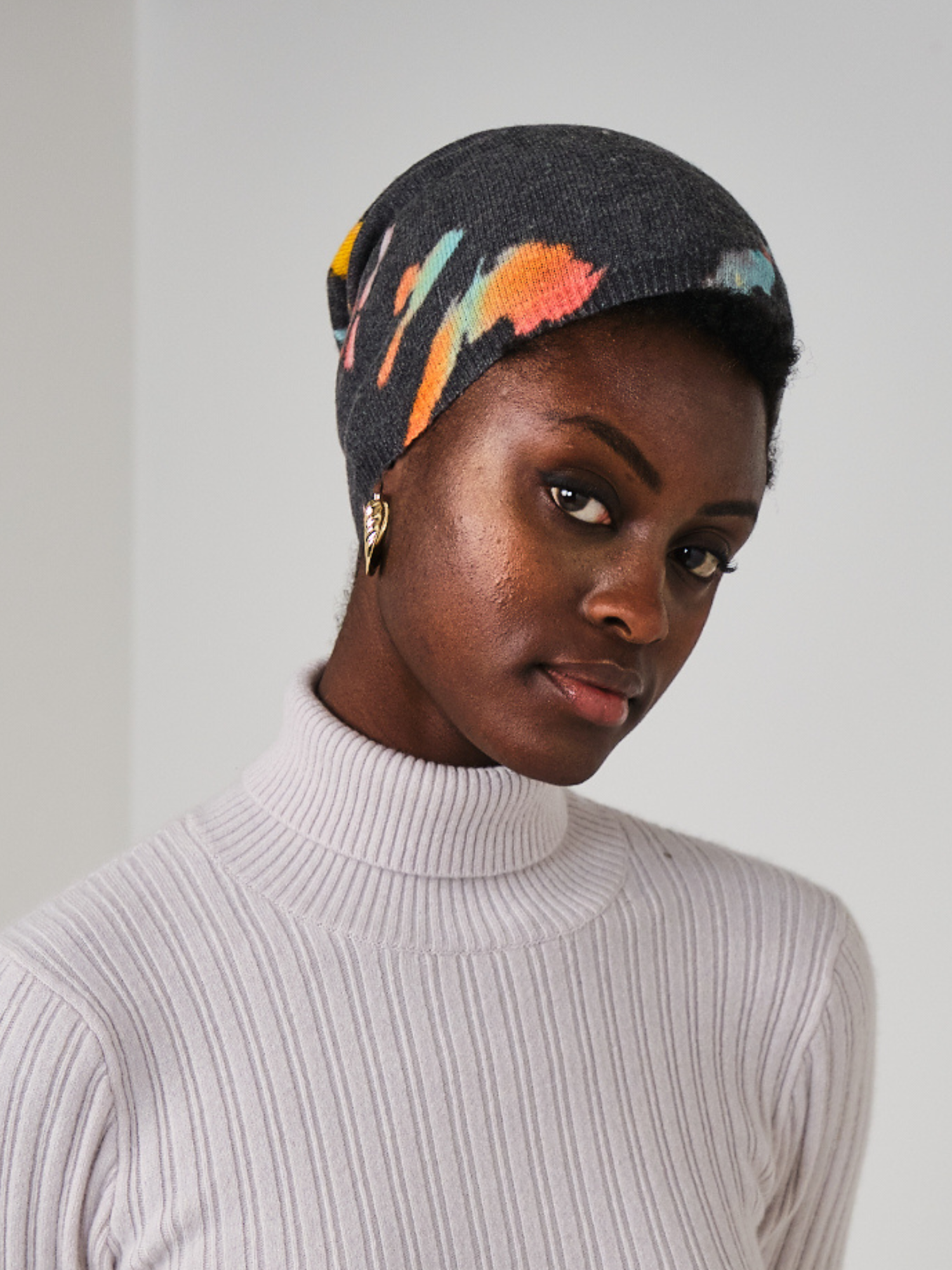 Women wearing black and multi colour hat